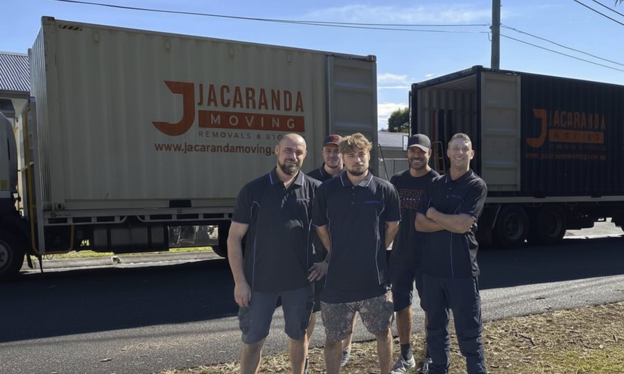 The Jacaranda removals team with their moving trucks